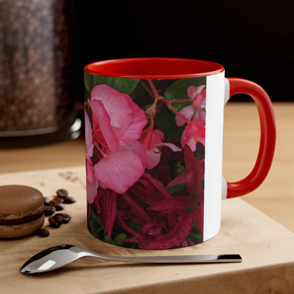 A vibrant pink flowers accent coffee mug with a white ceramic body and a contrasting colored interior and handle, showcasing its stylish design.