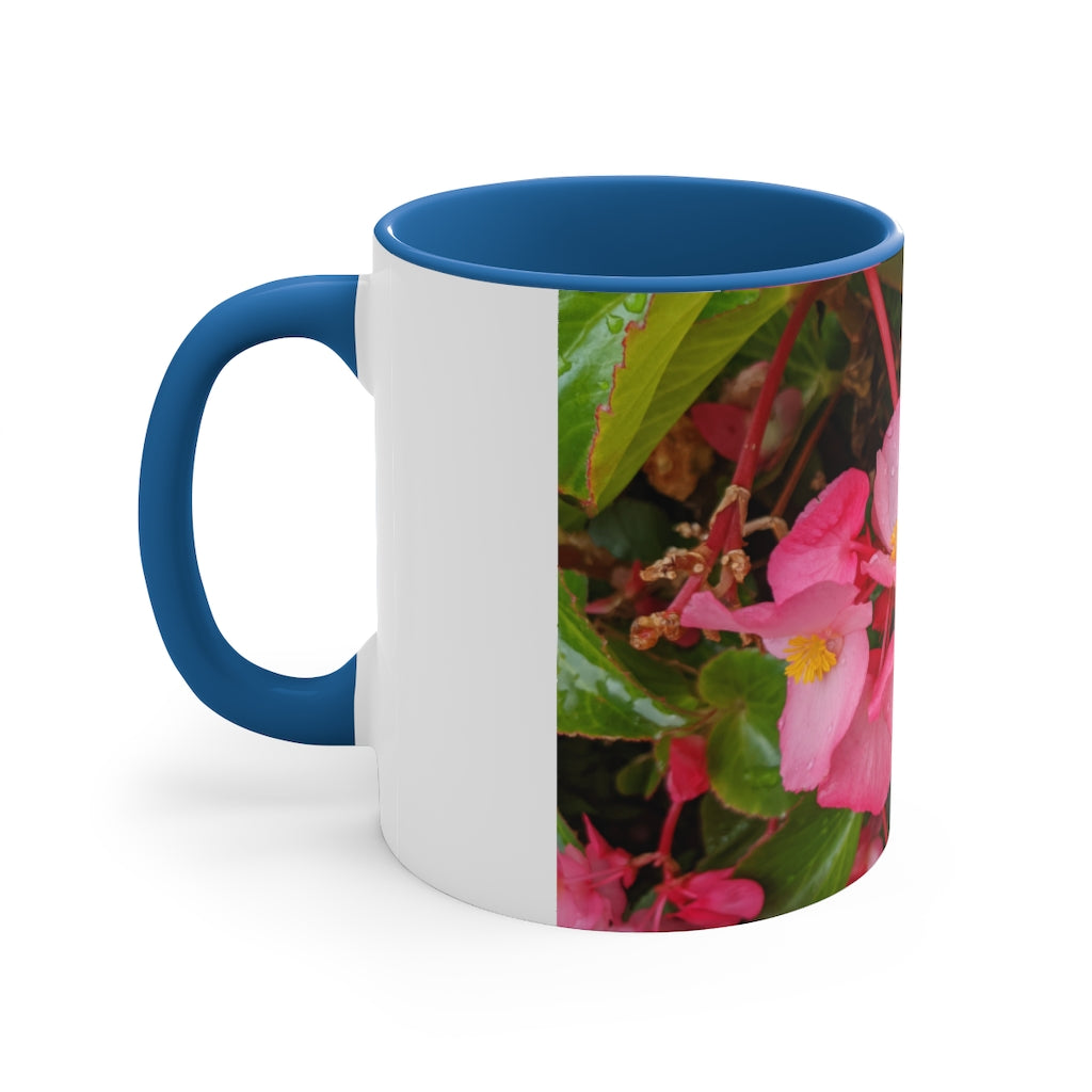 A vibrant pink flowers accent coffee mug with a white ceramic body and a contrasting colored interior and handle, showcasing its stylish design.