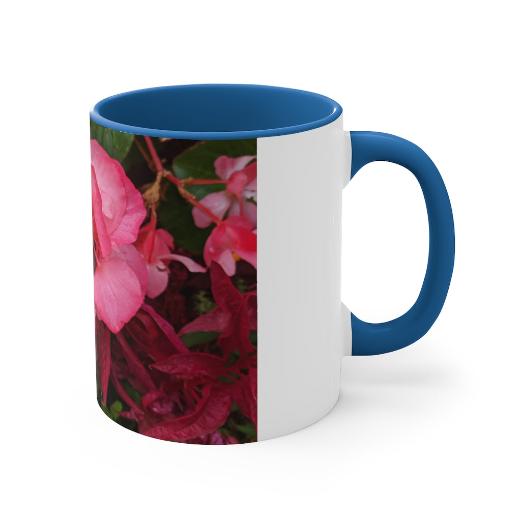 A vibrant pink flowers accent coffee mug with a white ceramic body and a contrasting colored interior and handle, showcasing its stylish design.