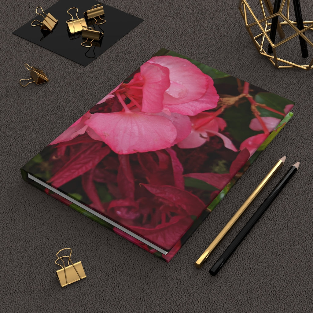 Pink Flowers Hardcover Journal with matte finish, featuring a floral design on the cover and lined pages inside.