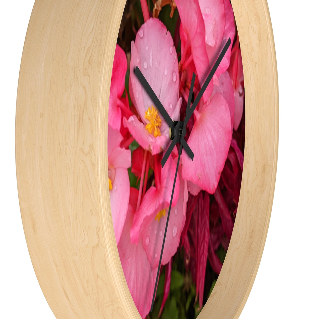 A stylish Pink Flowers Wall Clock with a wooden frame and plexiglass face, featuring a vibrant floral design.