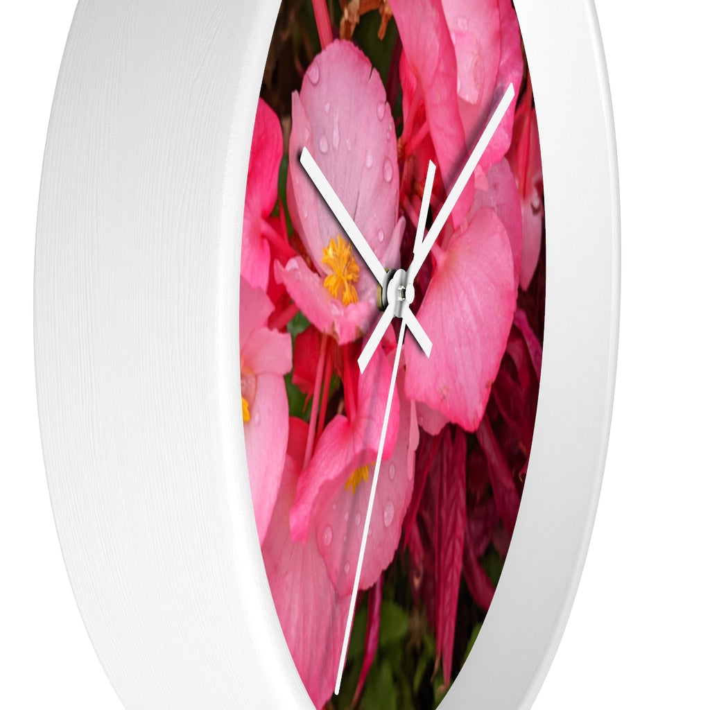 A stylish Pink Flowers Wall Clock with a wooden frame and plexiglass face, featuring a vibrant floral design.