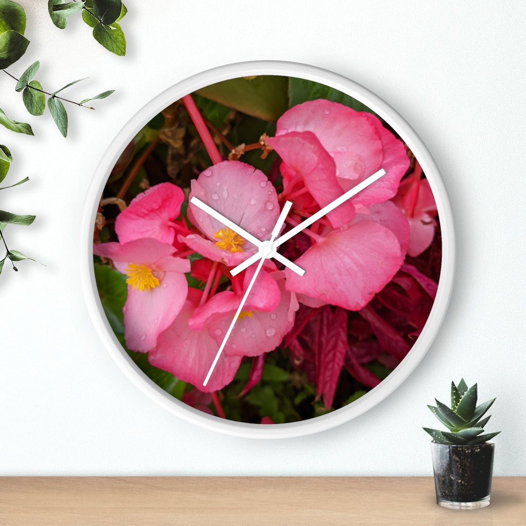 A stylish Pink Flowers Wall Clock with a wooden frame and plexiglass face, featuring a vibrant floral design.