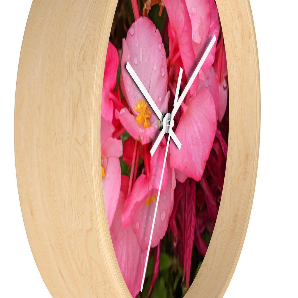 A stylish Pink Flowers Wall Clock with a wooden frame and plexiglass face, featuring a vibrant floral design.