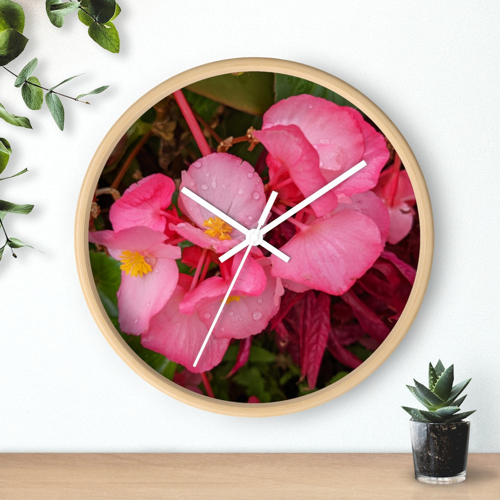 A stylish Pink Flowers Wall Clock with a wooden frame and plexiglass face, featuring a vibrant floral design.