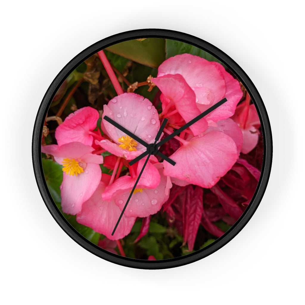 A stylish Pink Flowers Wall Clock with a wooden frame and plexiglass face, featuring a vibrant floral design.