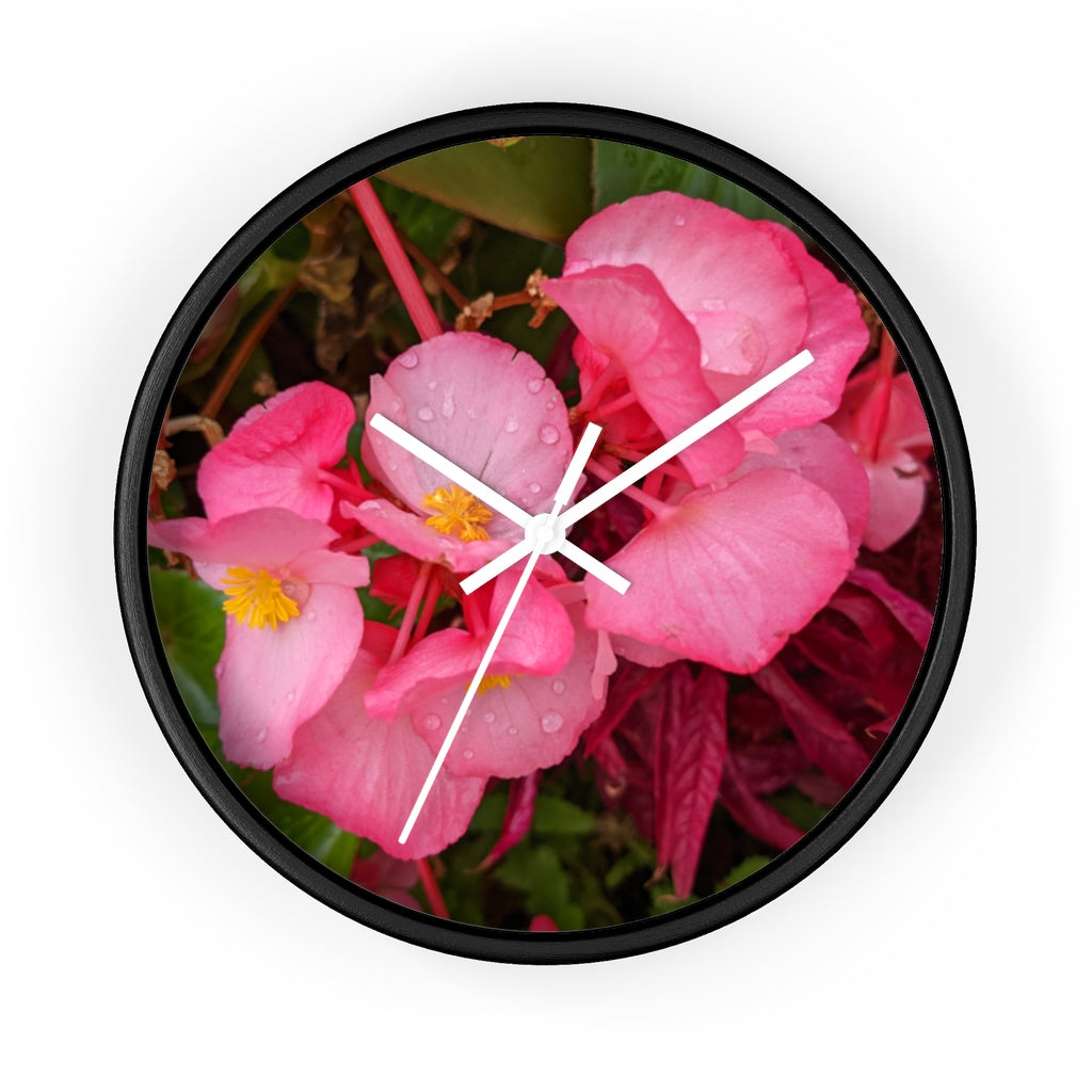 A stylish Pink Flowers Wall Clock with a wooden frame and plexiglass face, featuring a vibrant floral design.