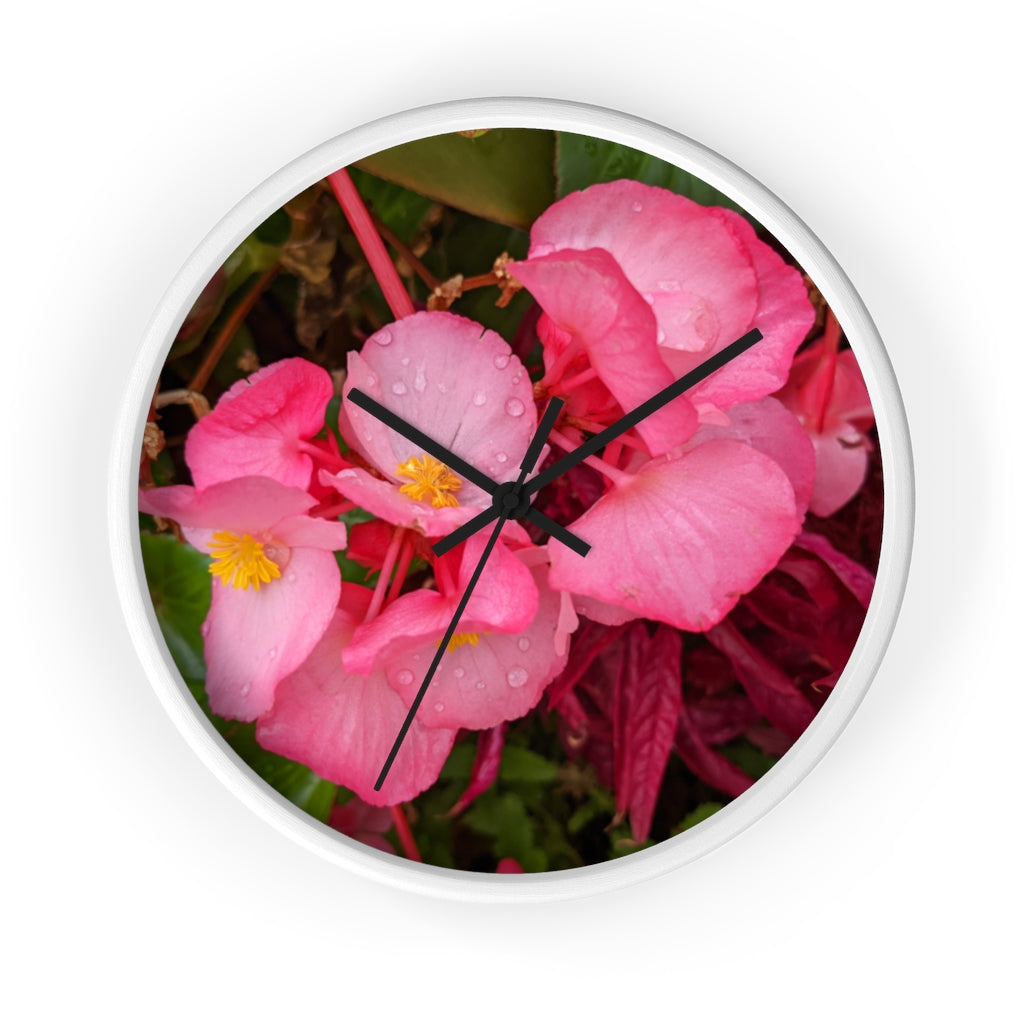 A stylish Pink Flowers Wall Clock with a wooden frame and plexiglass face, featuring a vibrant floral design.