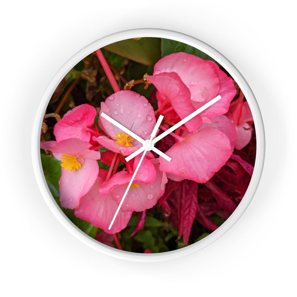 A stylish Pink Flowers Wall Clock with a wooden frame and plexiglass face, featuring a vibrant floral design.