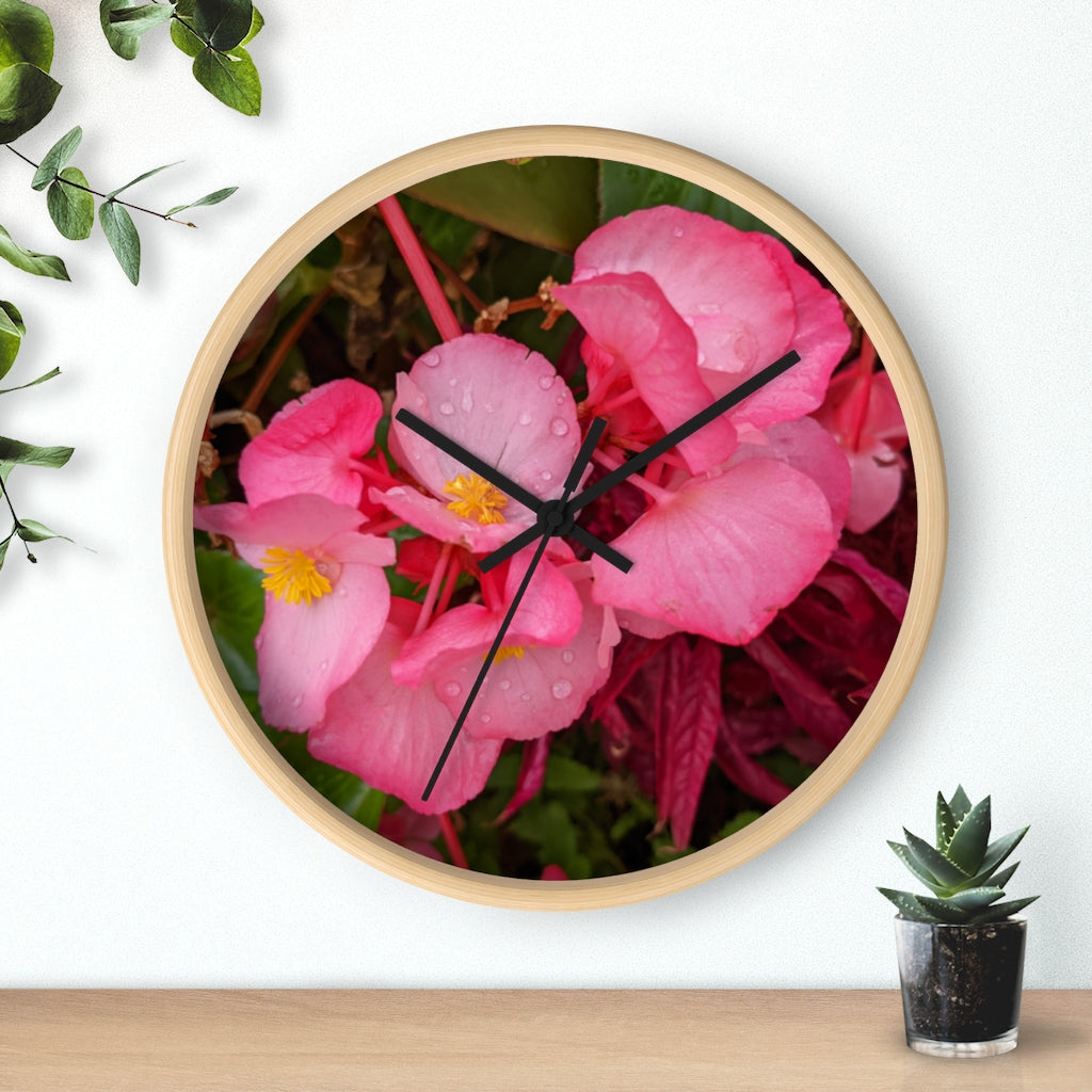 A stylish Pink Flowers Wall Clock with a wooden frame and plexiglass face, featuring a vibrant floral design.