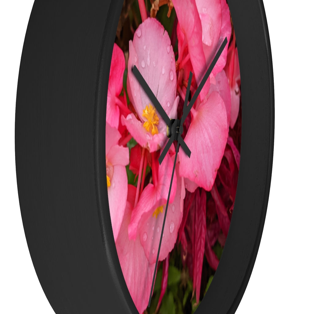 A stylish Pink Flowers Wall Clock with a wooden frame and plexiglass face, featuring a vibrant floral design.