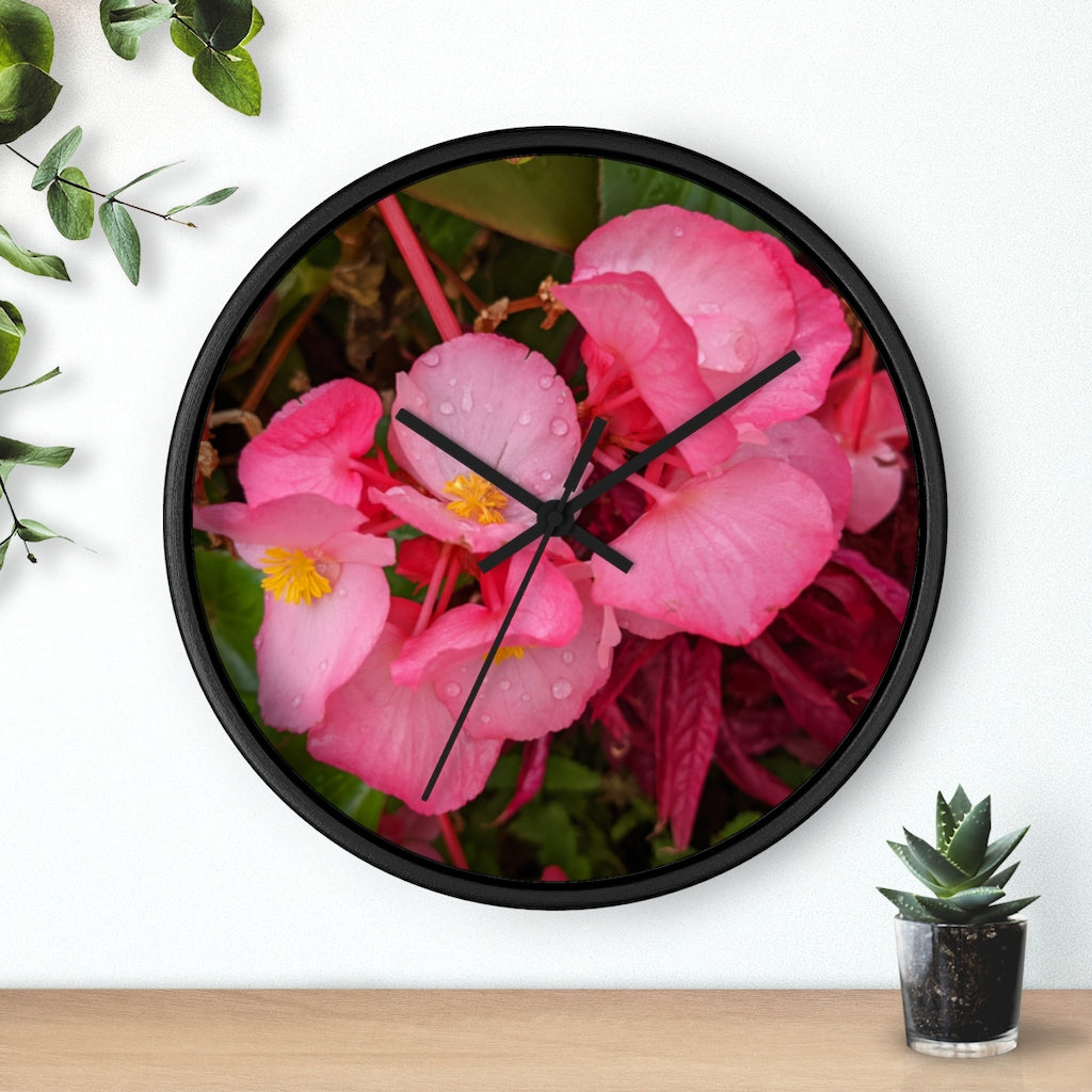 A stylish Pink Flowers Wall Clock with a wooden frame and plexiglass face, featuring a vibrant floral design.