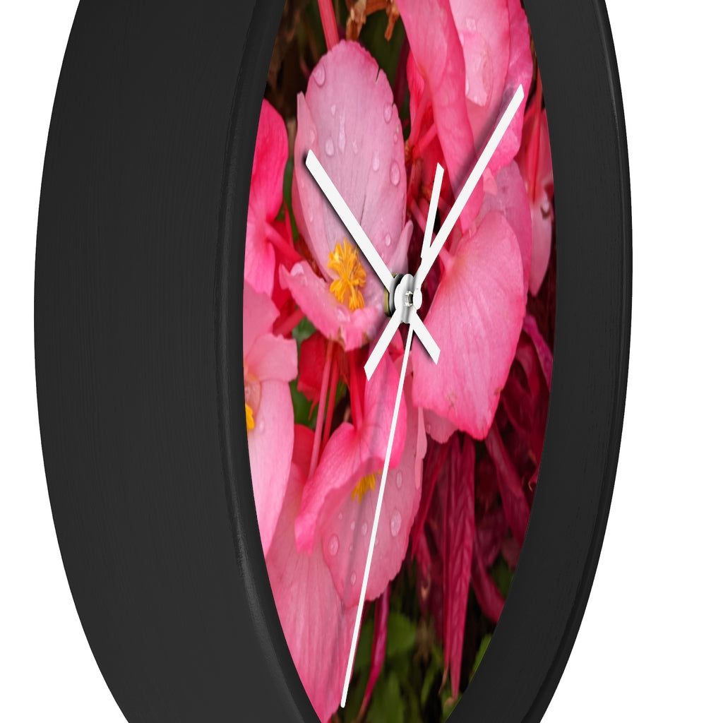 A stylish Pink Flowers Wall Clock with a wooden frame and plexiglass face, featuring a vibrant floral design.