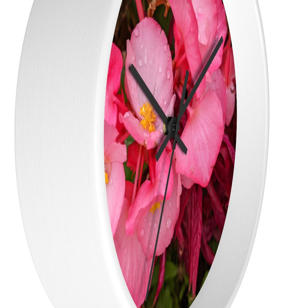 A stylish Pink Flowers Wall Clock with a wooden frame and plexiglass face, featuring a vibrant floral design.