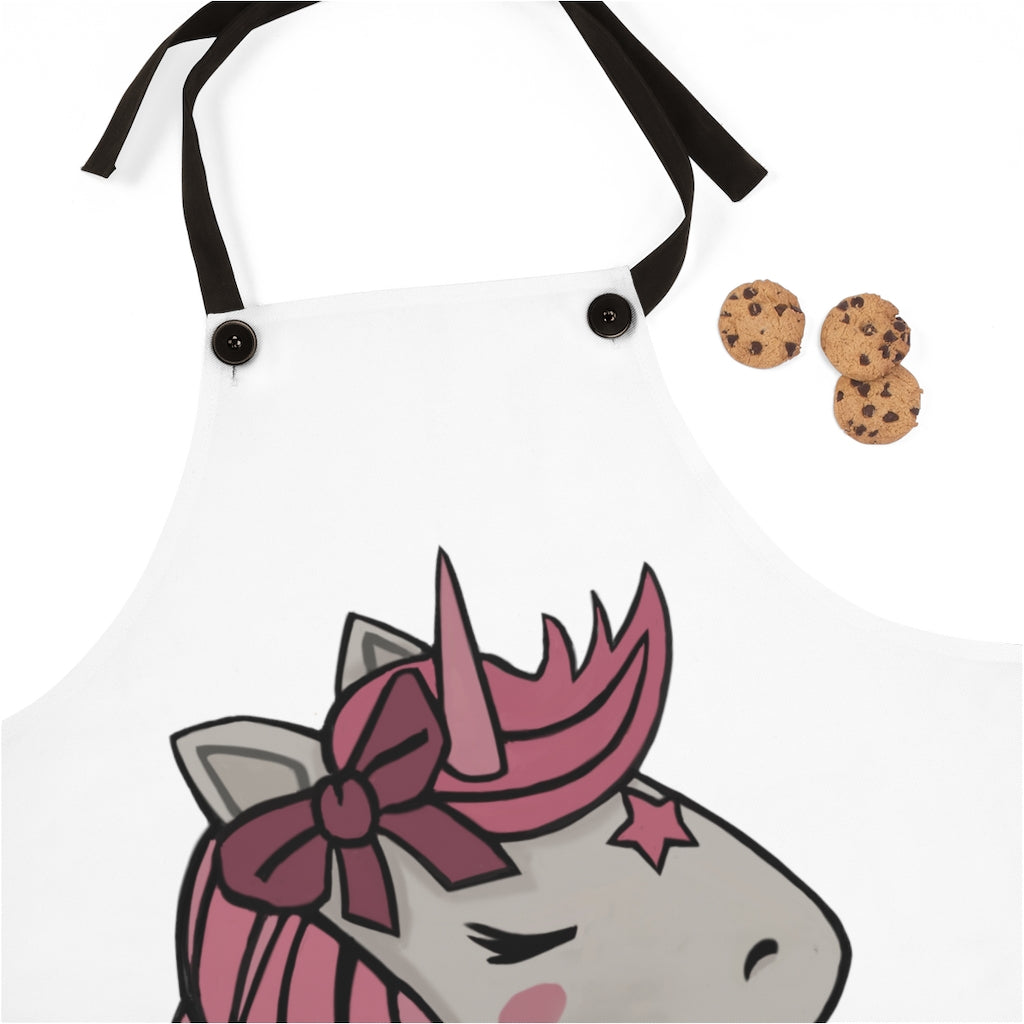 A vibrant pink apron featuring a whimsical unicorn head design, perfect for cooking and backyard gatherings.