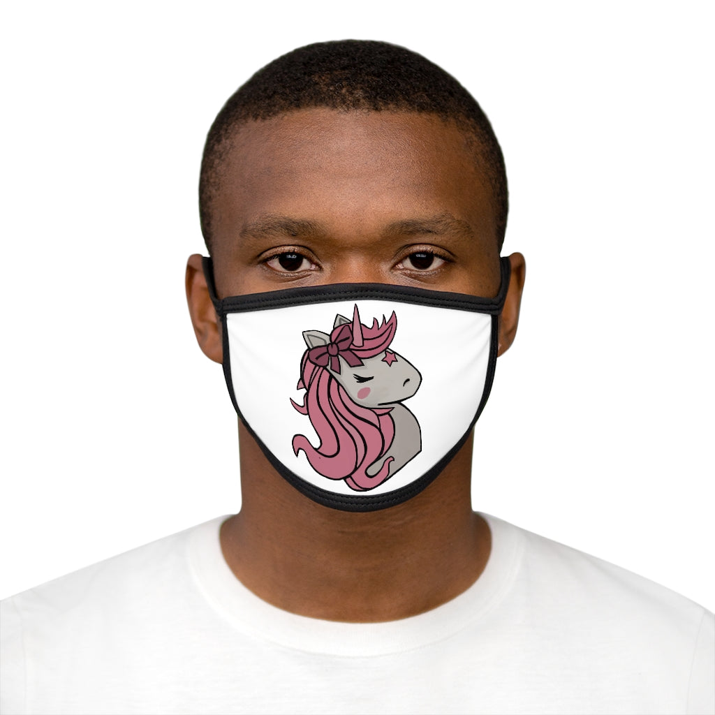 A colorful face mask featuring a pink hair unicorn design, with a black outer edge and earloops, suitable for everyday use.