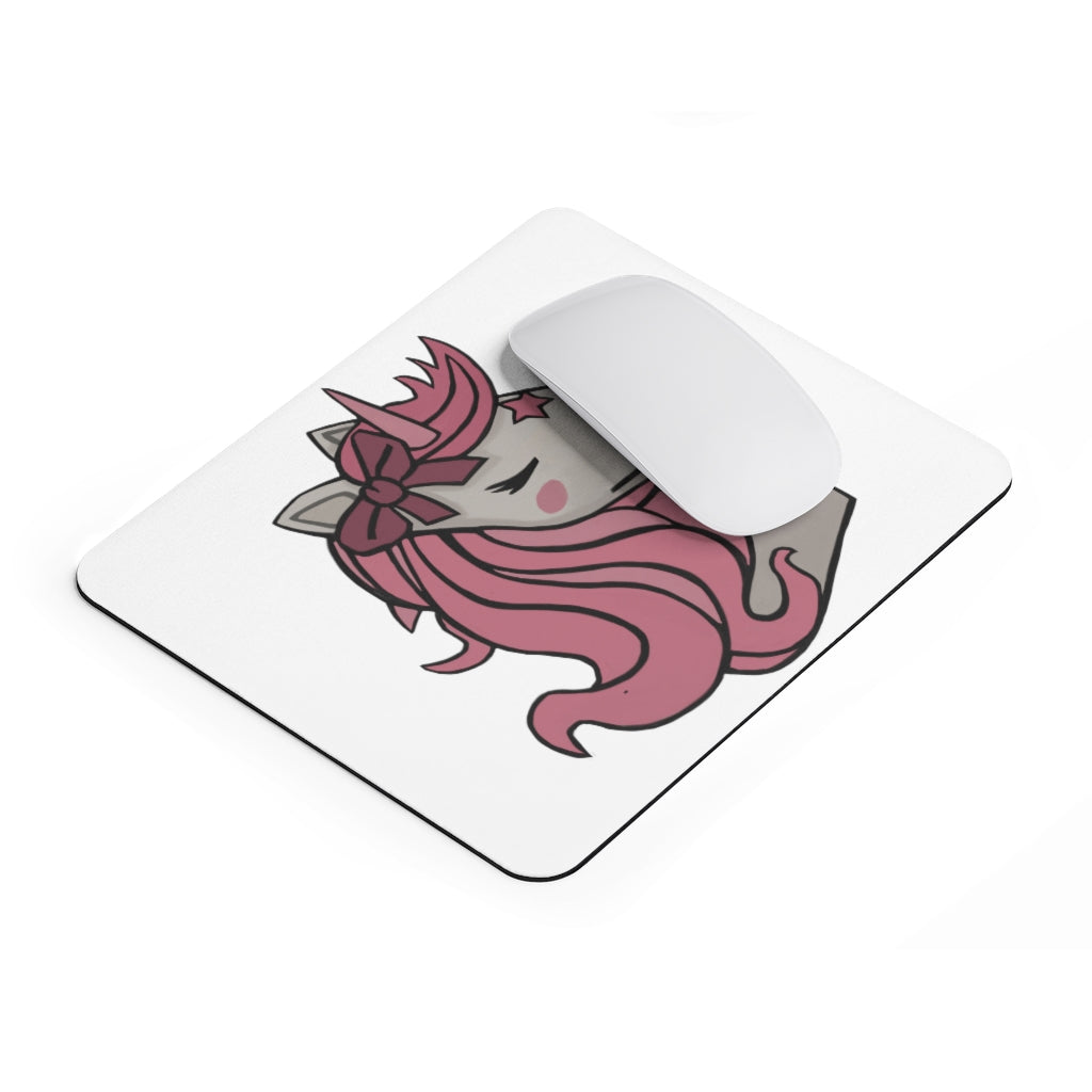 A colorful mouse pad featuring a pink-haired unicorn design, perfect for adding charm to any desk.