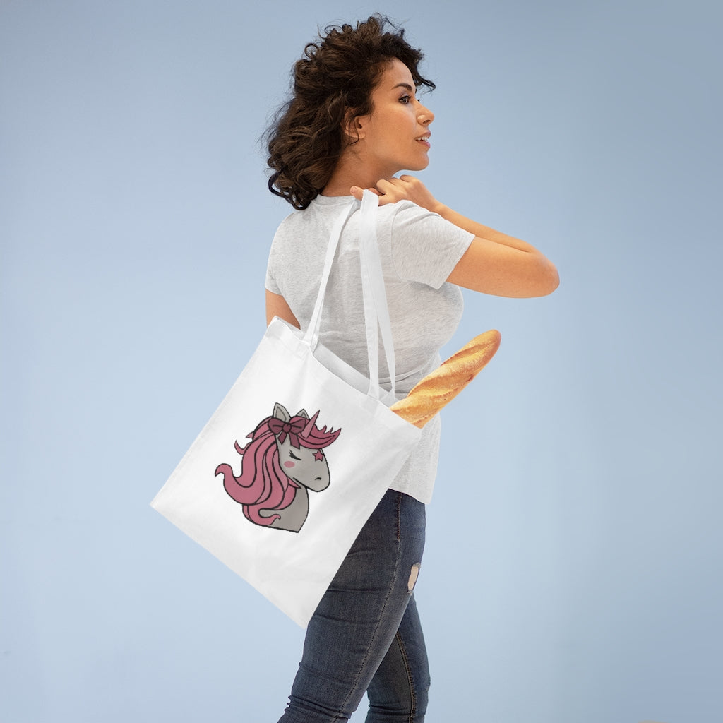 A stylish Pink Hair Unicorn Tote Bag made of 100% cotton with long handles and a vibrant unicorn design.