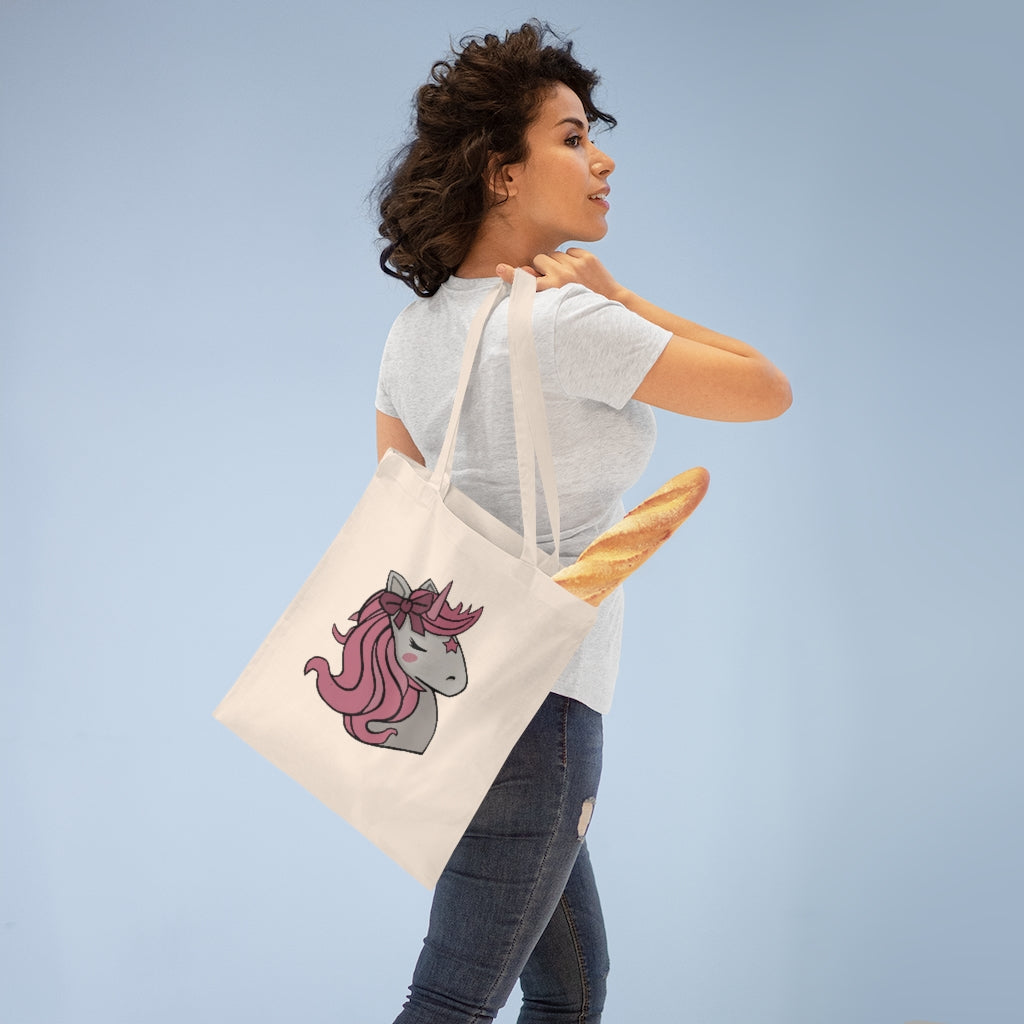 A stylish Pink Hair Unicorn Tote Bag made of 100% cotton with long handles and a vibrant unicorn design.