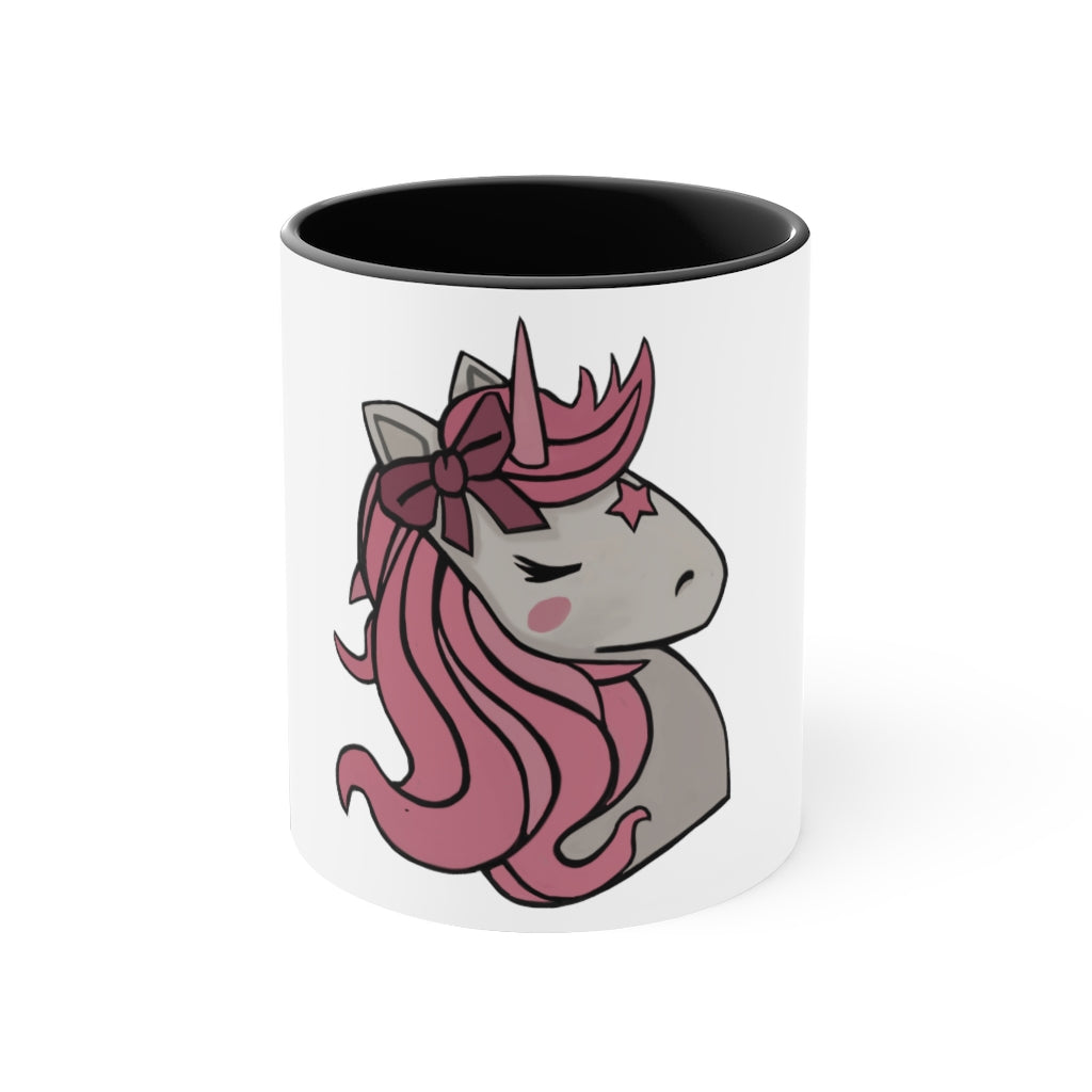 A vibrant pink unicorn accent coffee mug with a white exterior and pink interior, featuring a comfortable C-handle for easy gripping.