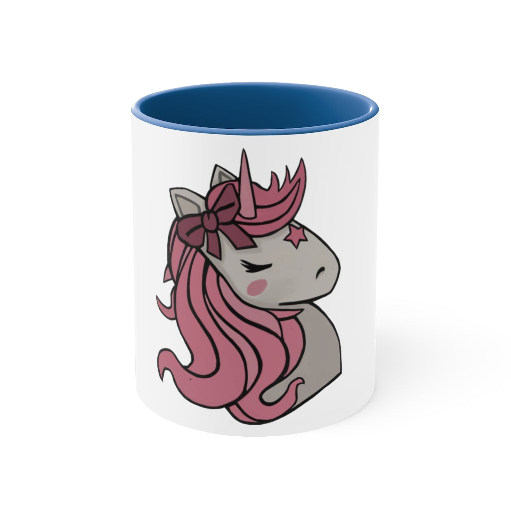 A vibrant pink unicorn accent coffee mug with a white exterior and pink interior, featuring a comfortable C-handle for easy gripping.