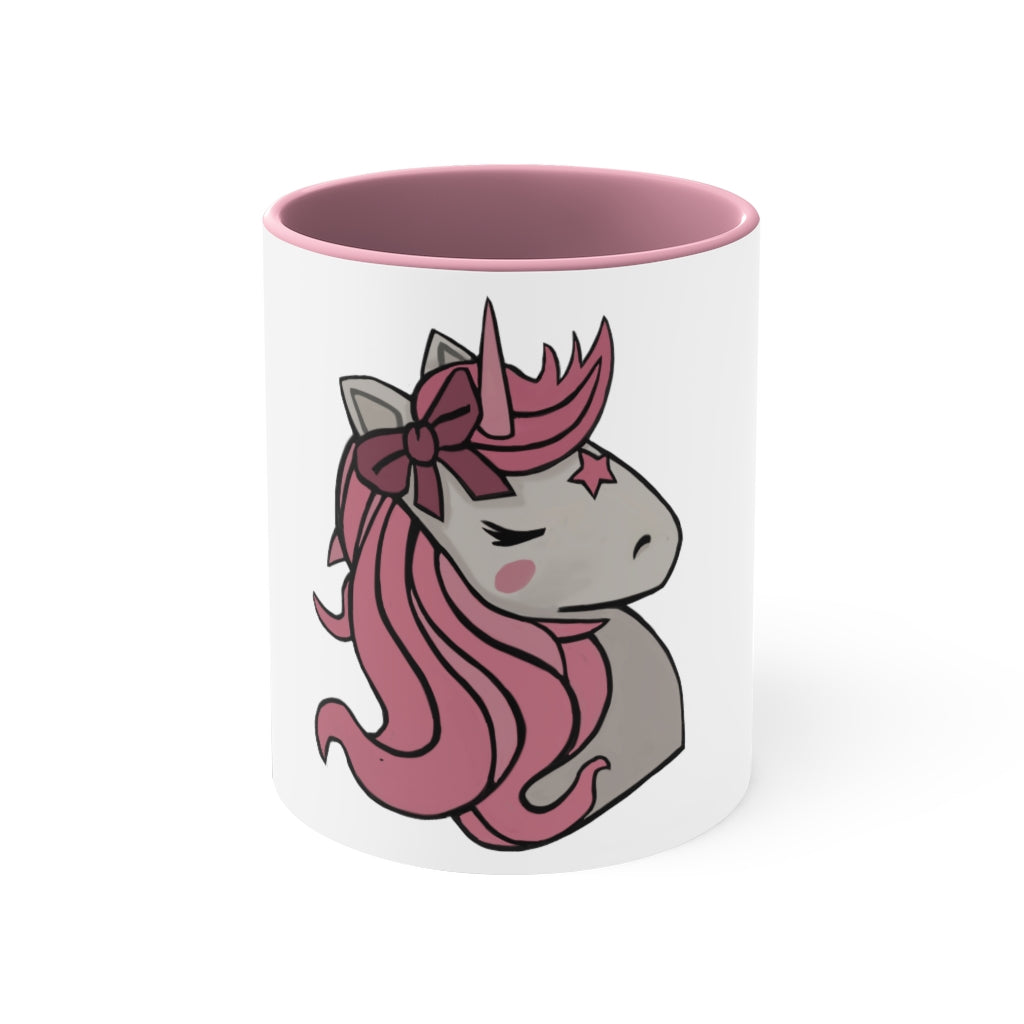 A vibrant pink unicorn accent coffee mug with a white exterior and pink interior, featuring a comfortable C-handle for easy gripping.