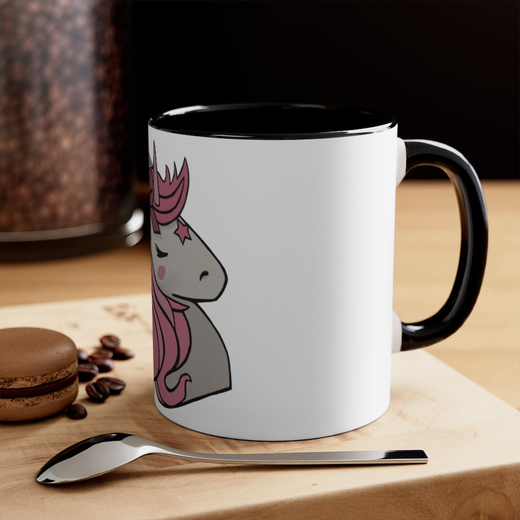 A vibrant pink unicorn accent coffee mug with a white exterior and pink interior, featuring a comfortable C-handle for easy gripping.