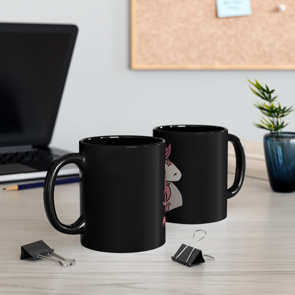 A stylish black ceramic mug featuring a vibrant pink unicorn design, perfect for coffee or tea.