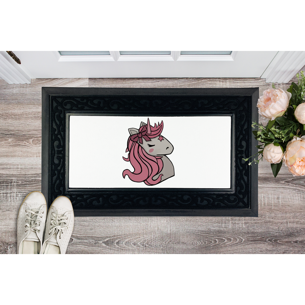 A vibrant pink unicorn door mat with a heavy-duty rubber base and a stylish fabric brush border, perfect for home entryways.