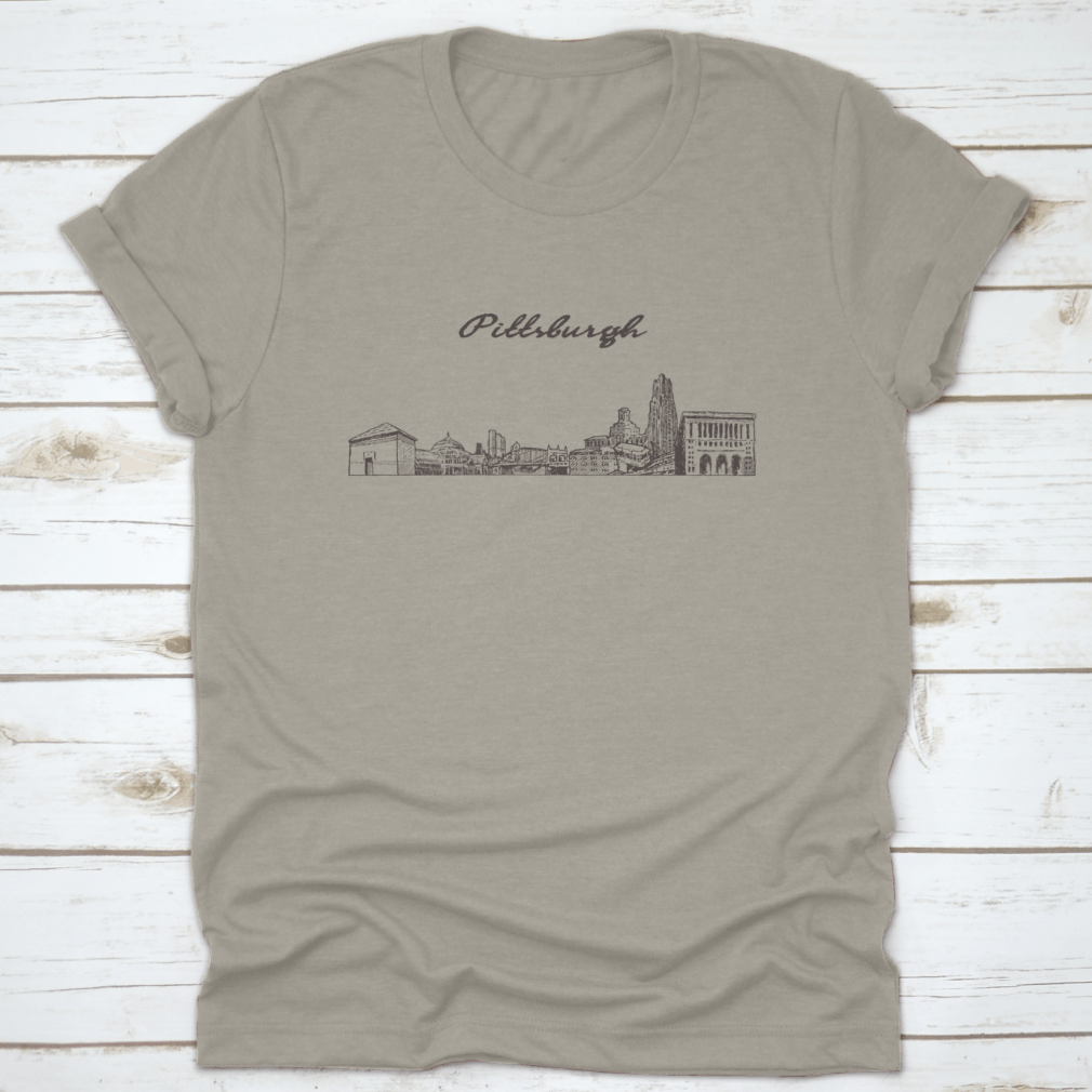 Hand-drawn vector illustration of the Pittsburgh skyline on a comfortable cotton t-shirt, showcasing iconic buildings and structures.