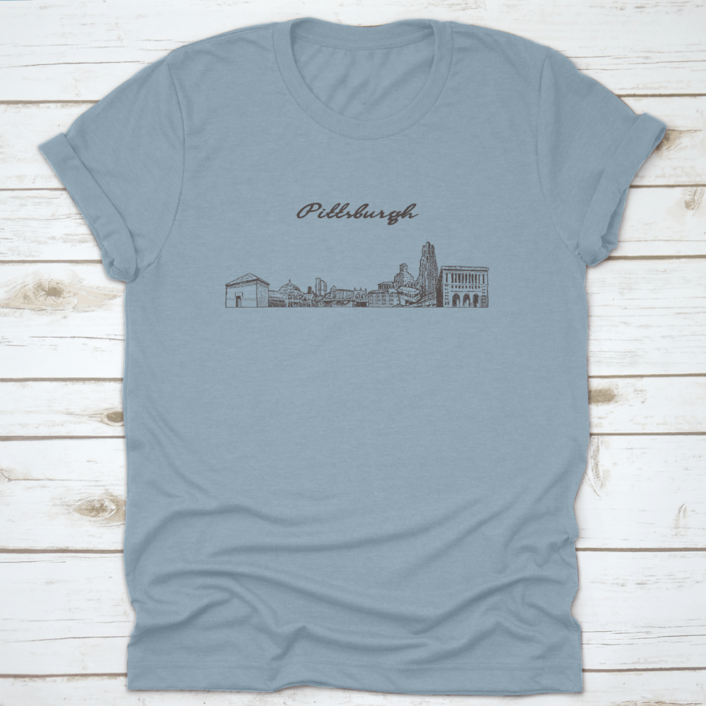 Hand-drawn vector illustration of the Pittsburgh skyline on a comfortable cotton t-shirt, showcasing iconic buildings and structures.