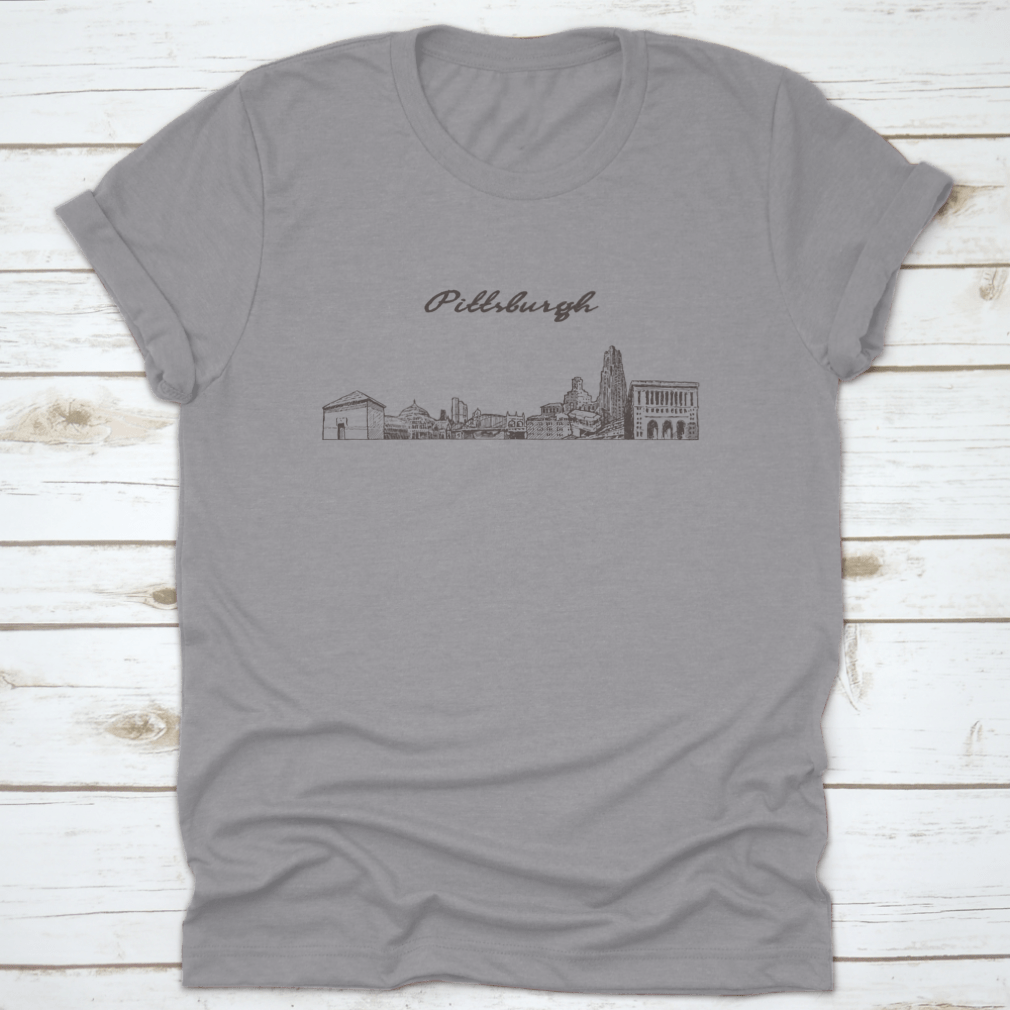 Hand-drawn vector illustration of the Pittsburgh skyline on a comfortable cotton t-shirt, showcasing iconic buildings and structures.