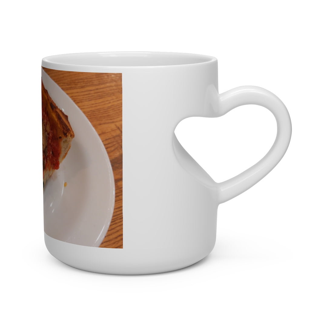 A white ceramic heart-shaped mug with a heart-shaped handle, perfect for hot beverages.