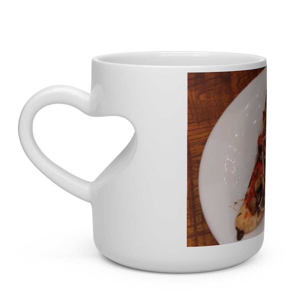 A white ceramic heart-shaped mug with a heart-shaped handle, perfect for hot beverages.