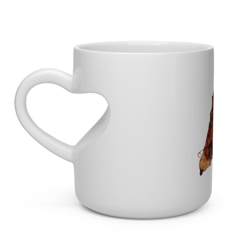 A white ceramic mug shaped like a heart, featuring a heart-shaped handle and round corners, ideal for hot beverages.