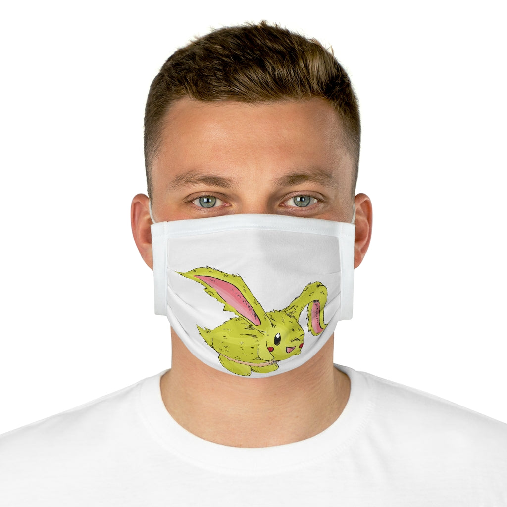 Pon-Pon Cotton Face Mask featuring vibrant motifs and adjustable earloops, made from 100% cotton for comfort and style.