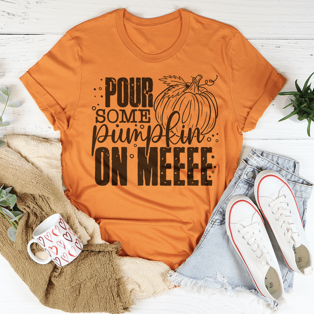 A cozy Pour Some Pumpkin On Me T-Shirt made from soft ring-spun cotton, featuring a playful pumpkin design, perfect for fall fashion.