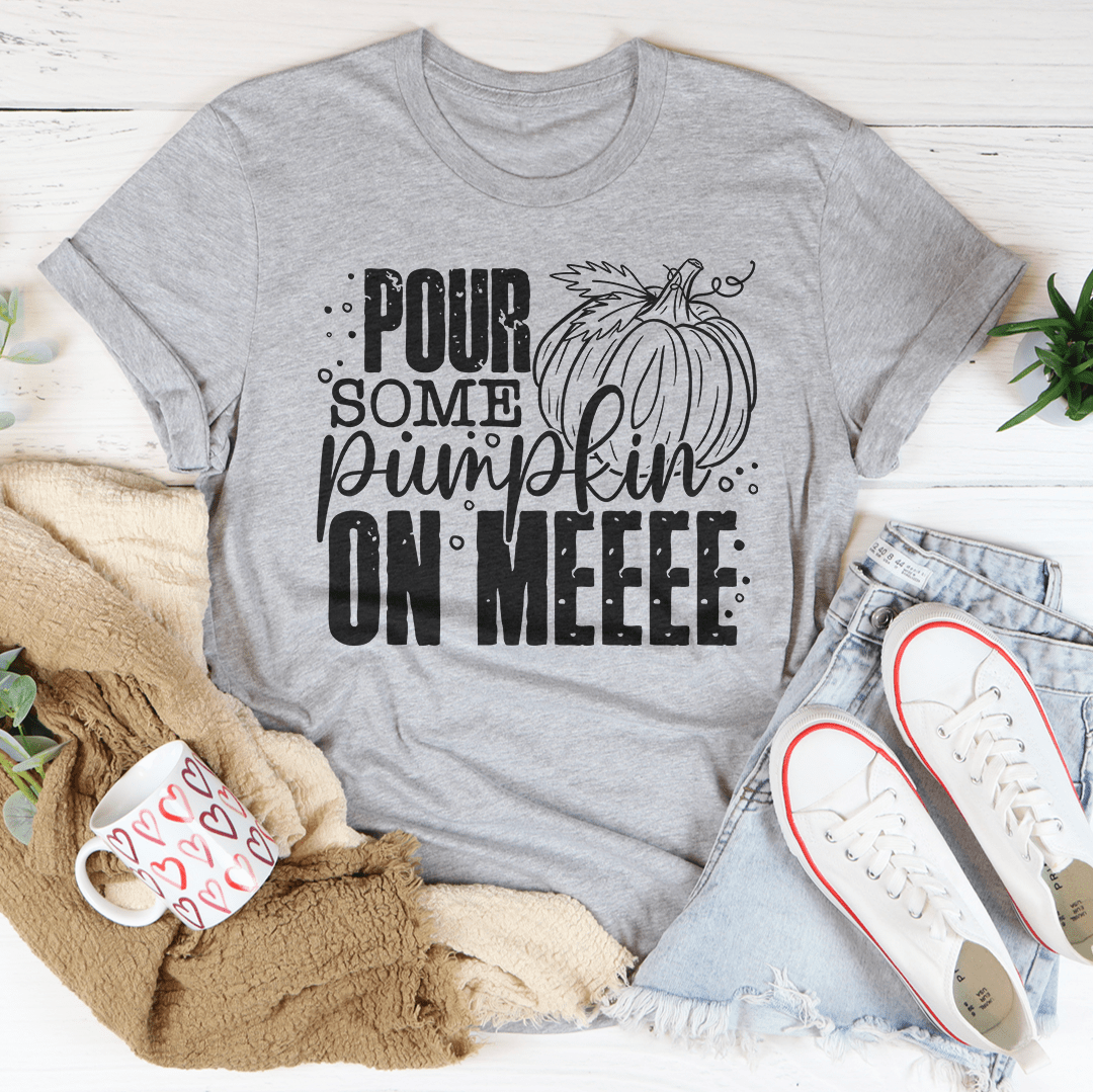 A cozy Pour Some Pumpkin On Me T-Shirt made from soft ring-spun cotton, featuring a playful pumpkin design, perfect for fall fashion.