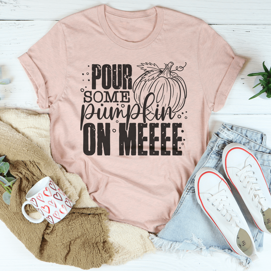 A cozy Pour Some Pumpkin On Me T-Shirt made from soft ring-spun cotton, featuring a playful pumpkin design, perfect for fall fashion.