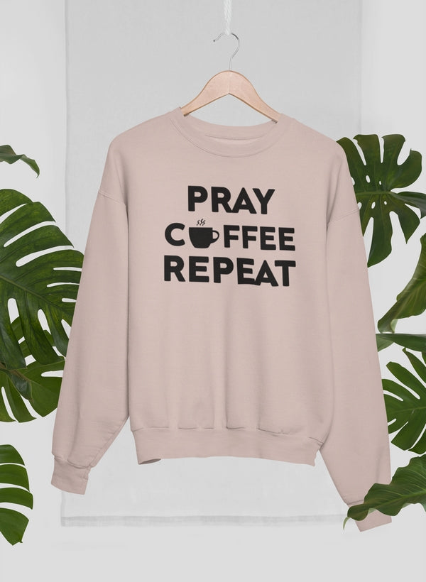 A cozy Pray Coffee Repeat Sweat Shirt made from 100% soft ring-spun cotton, featuring a unique digitally printed design.