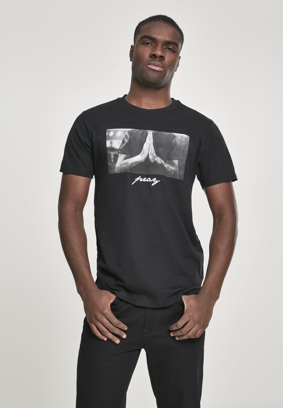 A stylish Pray T-Shirt made from 100% cotton, featuring a comfortable fit and versatile design suitable for casual wear.