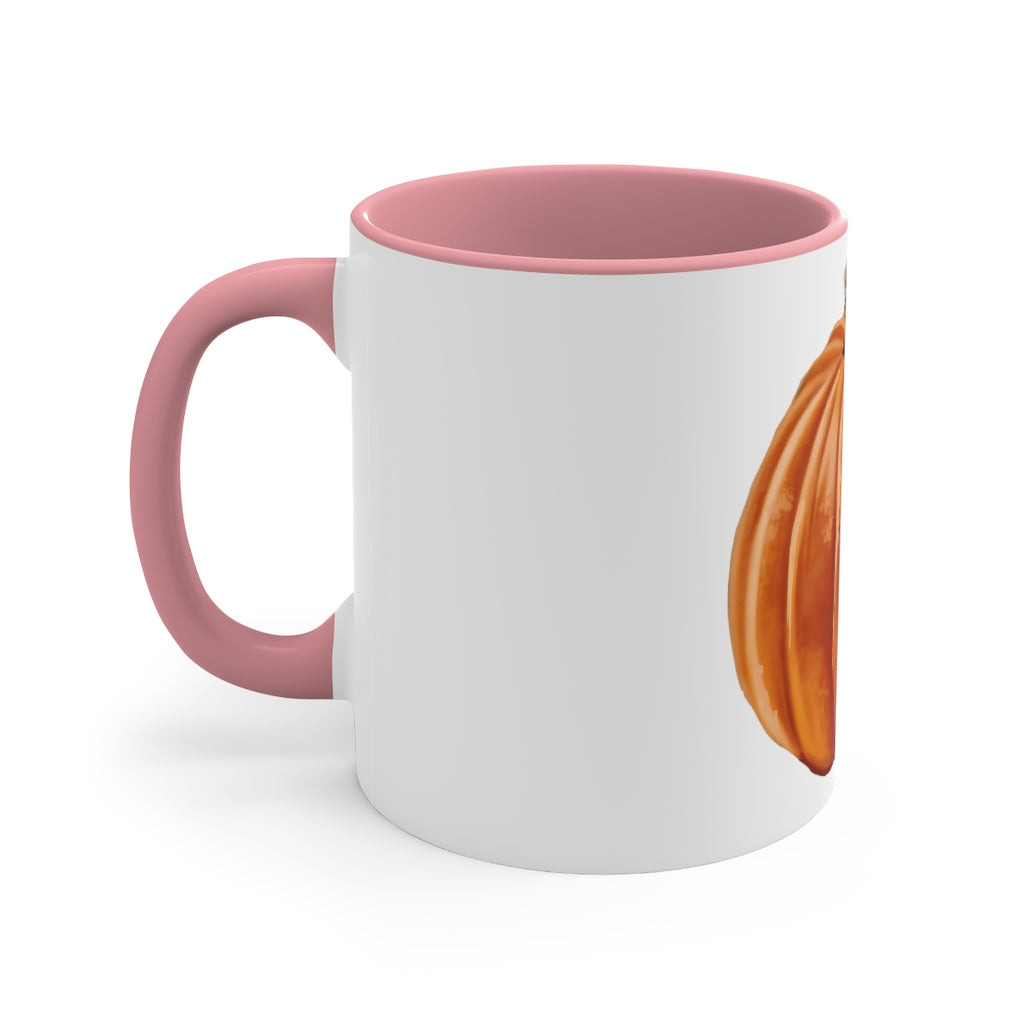 A vibrant pumpkin accent coffee mug with a white ceramic exterior and a contrasting pumpkin-colored interior and handle, perfect for coffee lovers.