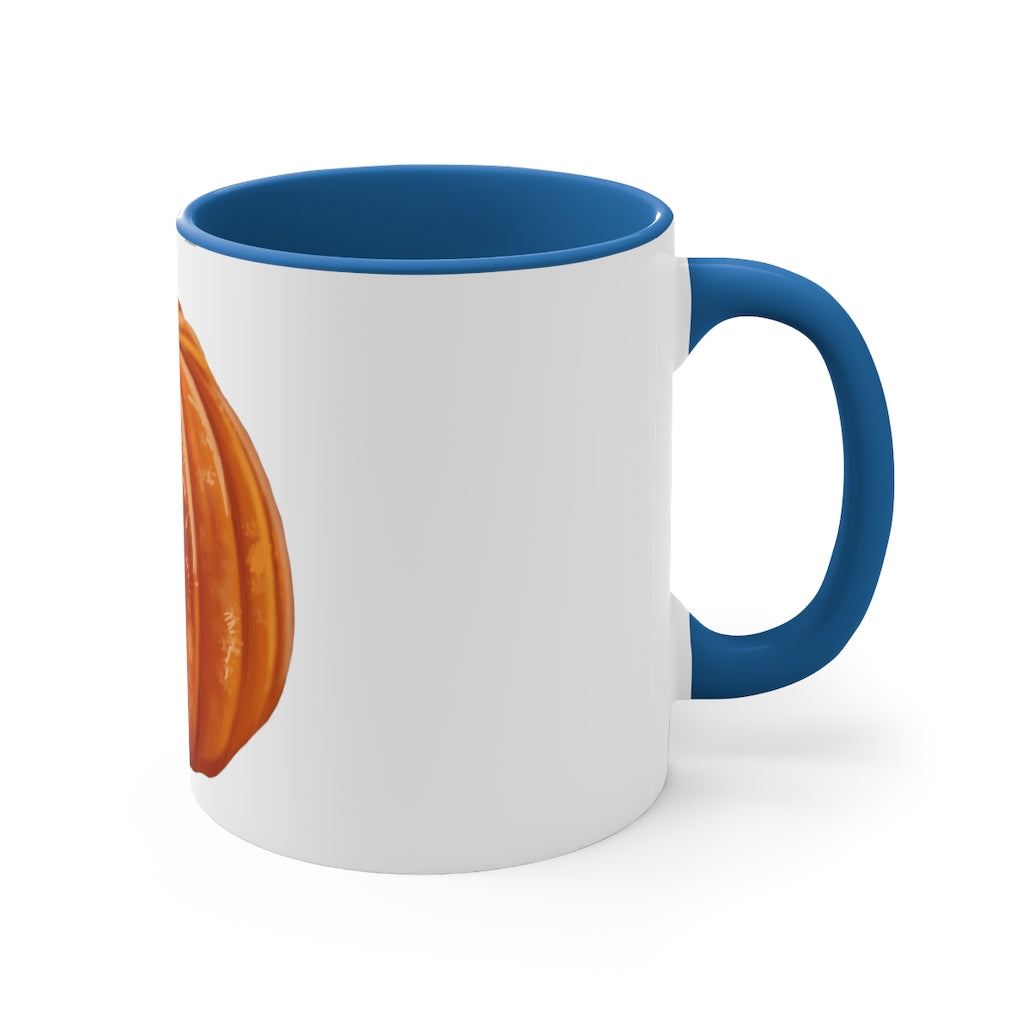 A vibrant pumpkin accent coffee mug with a white ceramic exterior and a contrasting pumpkin-colored interior and handle, perfect for coffee lovers.