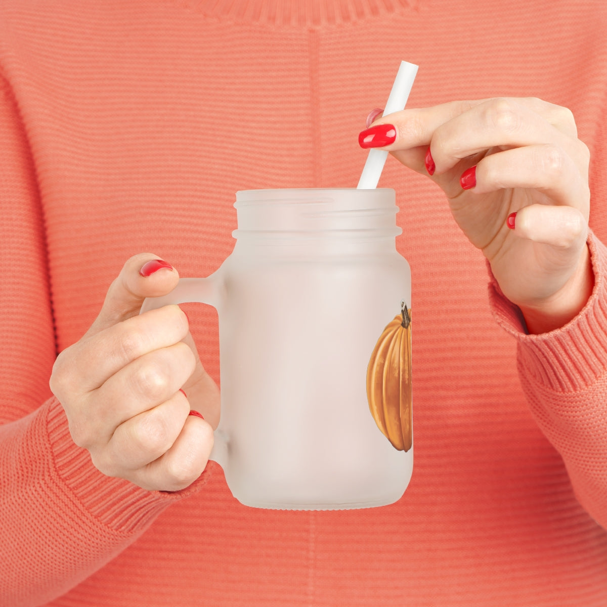 A stylish Pumpkin Mason Jar made of frosted glass, featuring a straw and lid, perfect for personalized drinks.