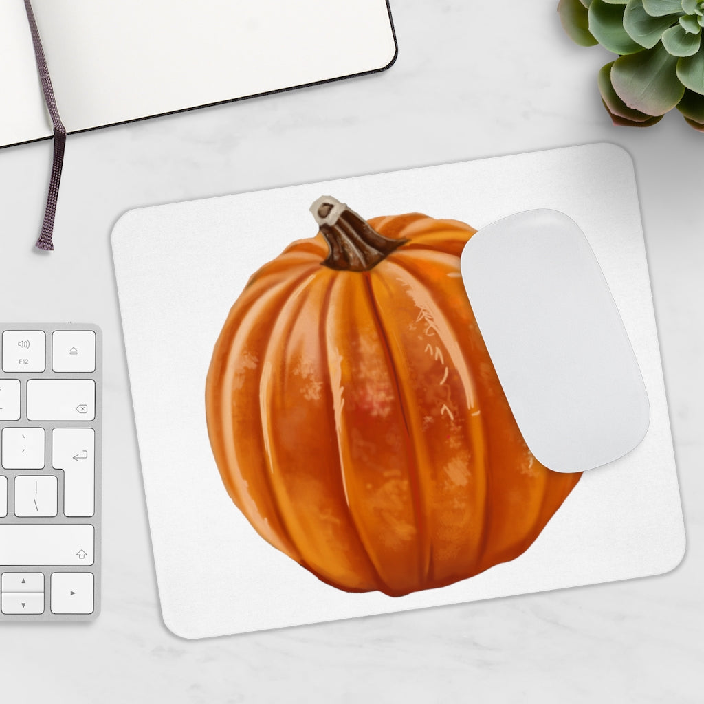 A vibrant pumpkin-themed mouse pad featuring a smooth neoprene surface, perfect for enhancing desk decor.