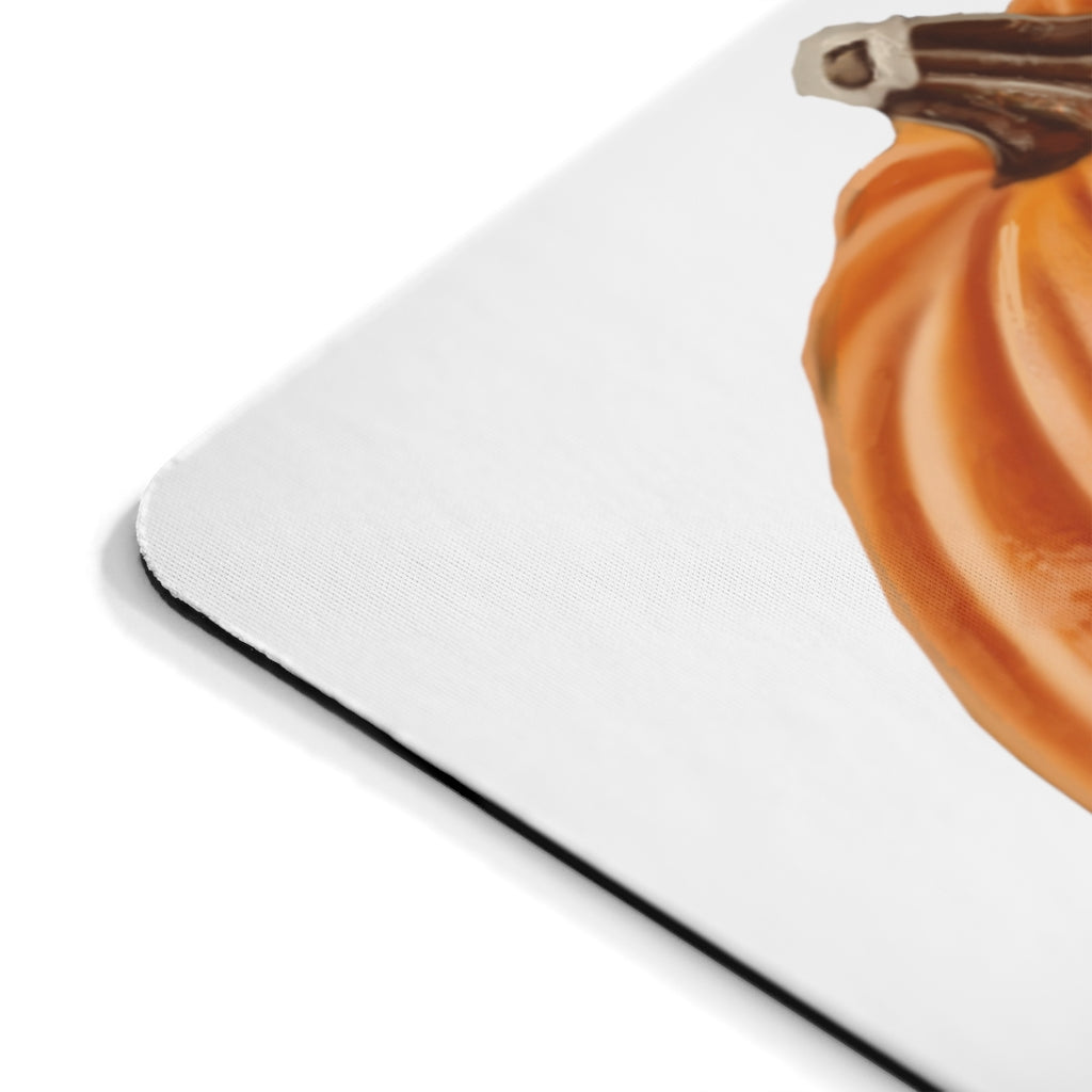 A vibrant pumpkin-themed mouse pad featuring a smooth neoprene surface, perfect for enhancing desk decor.