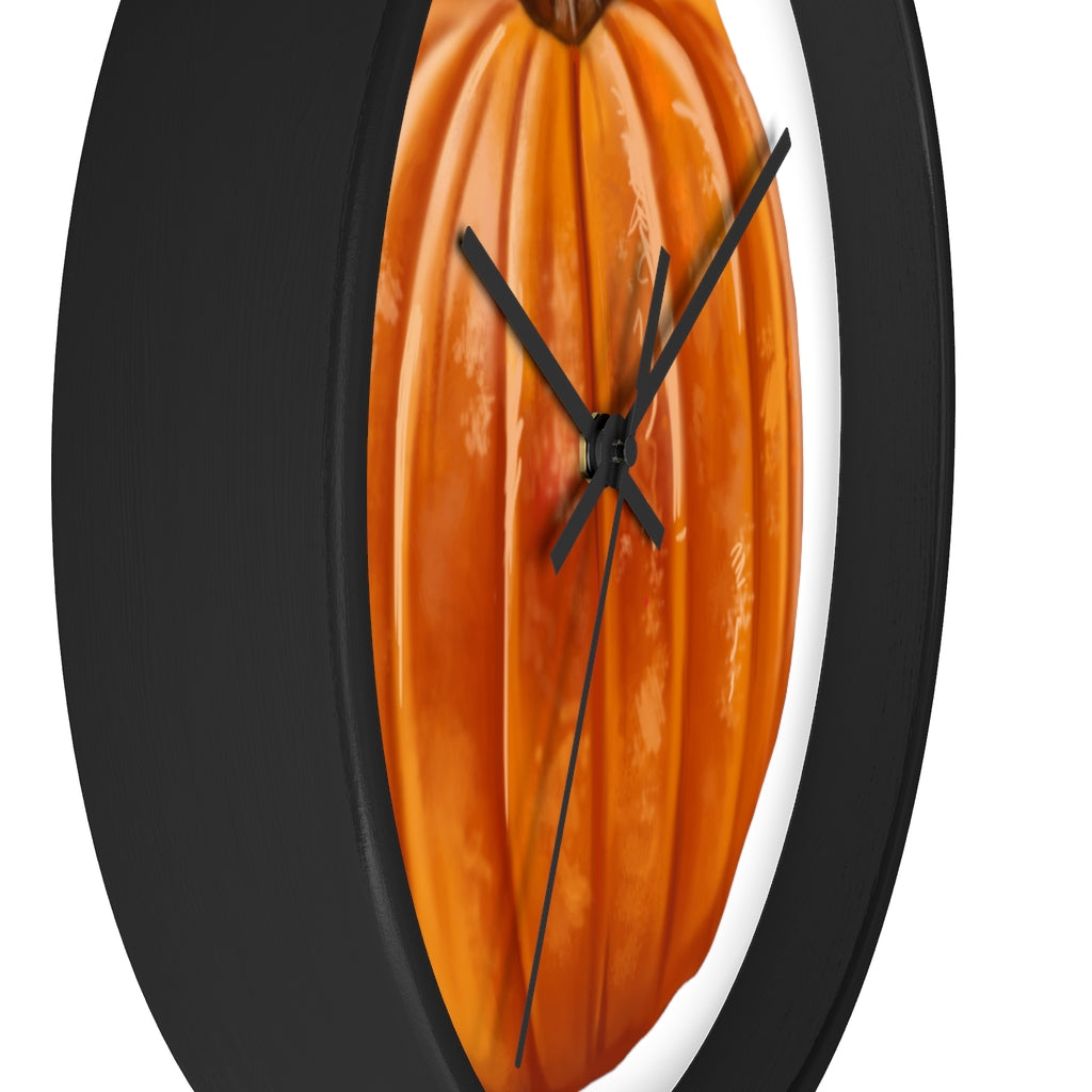 A stylish Pumpkin Wall Clock featuring a wooden frame and plexiglass face, perfect for indoor decor.