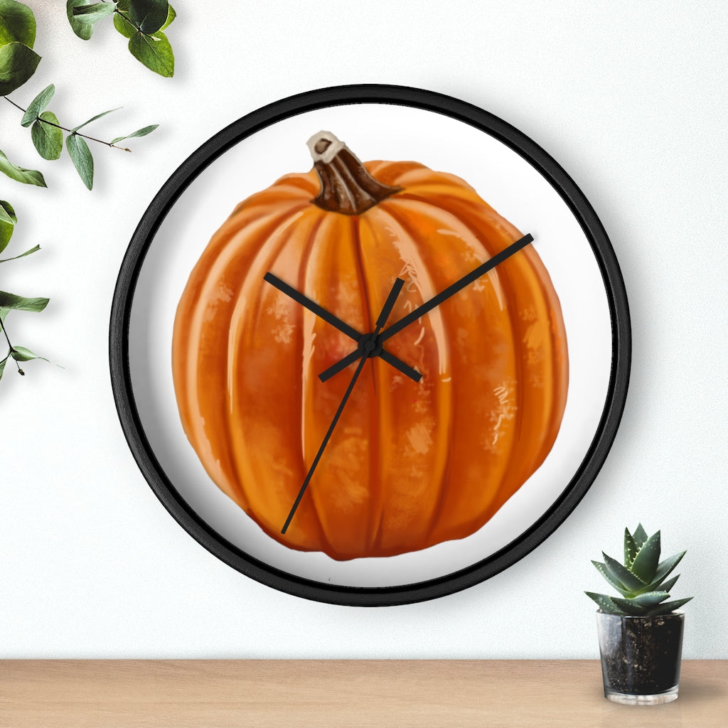 A stylish Pumpkin Wall Clock featuring a wooden frame and plexiglass face, perfect for indoor decor.