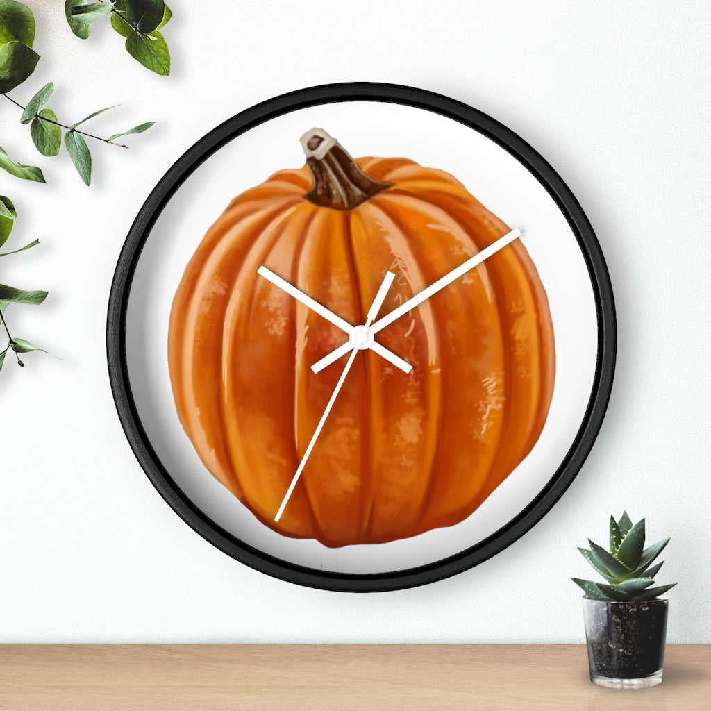 A stylish Pumpkin Wall Clock featuring a wooden frame and plexiglass face, perfect for indoor decor.