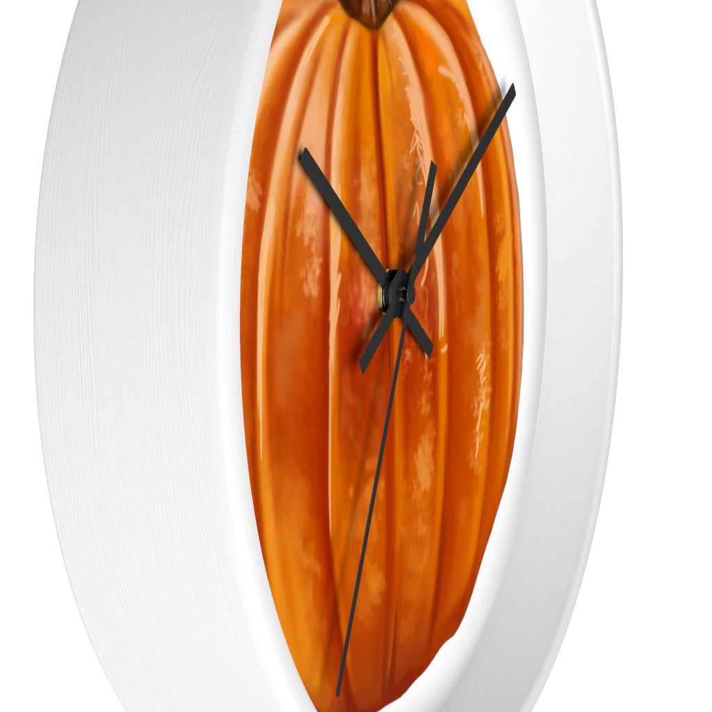 A stylish Pumpkin Wall Clock featuring a wooden frame and plexiglass face, perfect for indoor decor.